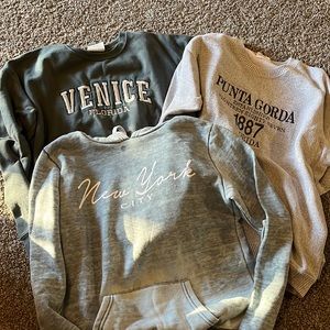 Florida and New York sweatshirts